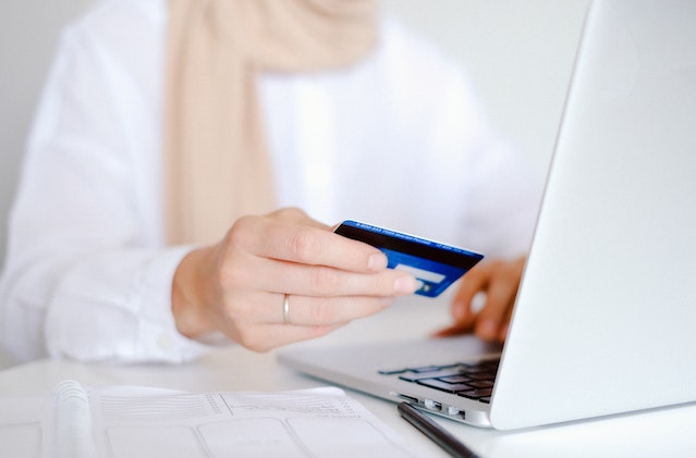 person making online payment with card